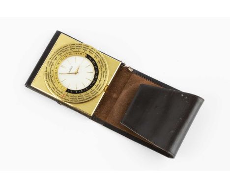 A Luxor 'world time' travel clock, in folding leather outer case, 5.5cm wide.
