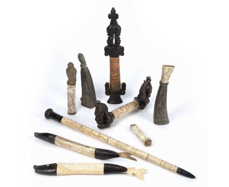 Tribal interest, a quantity of mainly Indonesian carved bone containers, including a calendar baton (9) Provenance: From the 