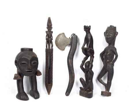 Tribal interest, a wooden dibber, Borneo, carved topped figure with his tongue stuck out, together with another naive tool an