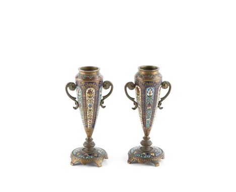 A pair of late 19th century gilt metal and champlevé enamel spill vases, each of twin-handled tapering form, decorated with p
