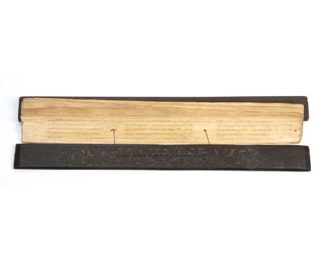 An old Indonesian lontar palm-leaf manuscript bound between wooden boards. with scripted text, 60cm length