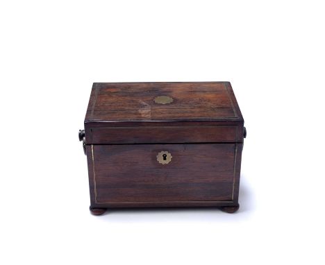 A Regency rosewood and brass strung tea caddy with ring handles, the hinged lid opening to reveal tea box and bowl aperture, 
