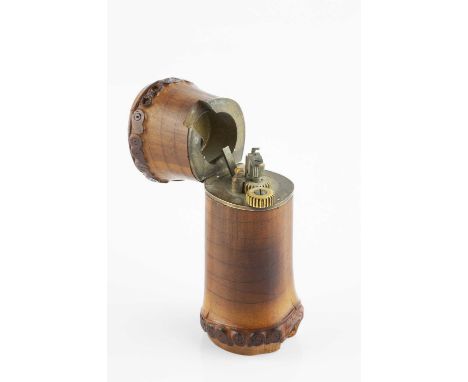 A Dunhill bamboo lighter, the sectional bamboo body with hinged cover, the base stamped 'Dunhill, Pat no. 405122, Made in Eng