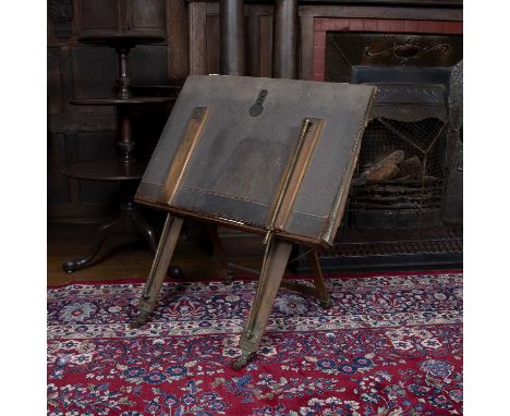 A late Victorian oak folio stand with easel type support and with Morocco leather covered fall, 82cm wide Provenance:  From t