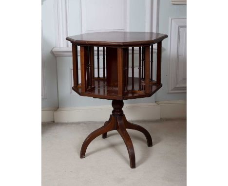 An Edwardian mahogany and satinwood banded octagonal book stand, with spindle turned divisions, on carved supports, 50.5cm wi