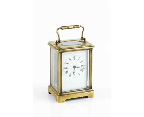 A French brass carriage timepiece, with white enamel dial, the case with bracket feet, 11.5cm high.