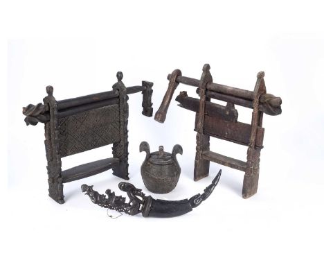 Tribal interest, two carved wood cotton gins from the Atoni of West Timor, one finely carved with geometric designs, 34cm hig