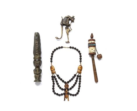 Tribal interest, a collection of small items which include an African beaded necklace, Tibetan rattle and an Indonesian betel