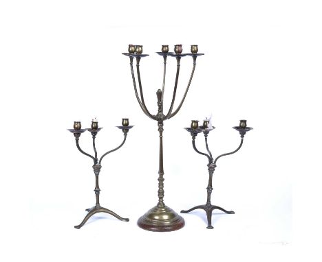 A 19th century brass five branch candelabrum, on knopped and tapered column, and circular base with mahogany plinth, 69cm hig