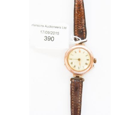 A ladies vintage 9ct gold wristwatch, round white enamelled dial, Swiss lever movement, Glasgow import hallmark 1915, 28 mm d