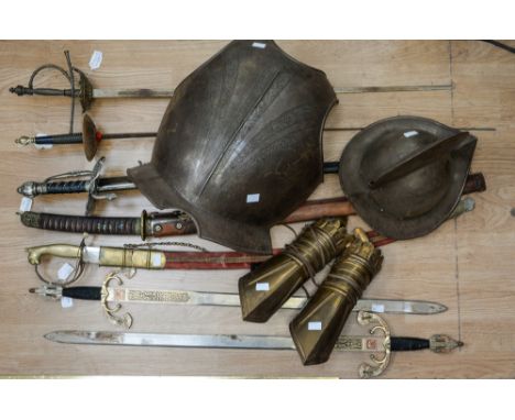  A set of modern reproduction armour comprising a breastplate, two hinged greaves and a pikeman's helmet, together with wall 