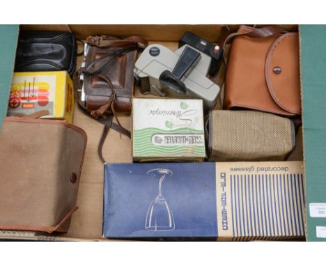 A collection of vintage cameras including Brownie, Kodak, viewer slides.