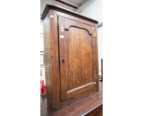 A 19th century beech and pine wall cupboard, the single door opening to reveal a single shelf