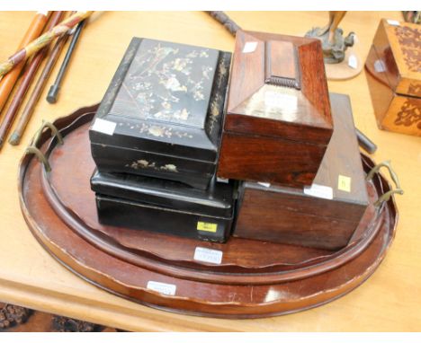 A pair of wooden trays, two Japanese lacquered boxes, a sarcophagus tea caddy and another box.