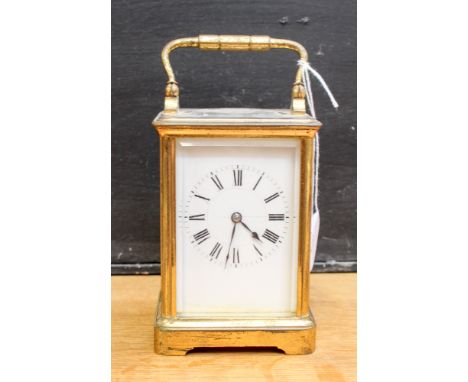 A brass carriage clock.