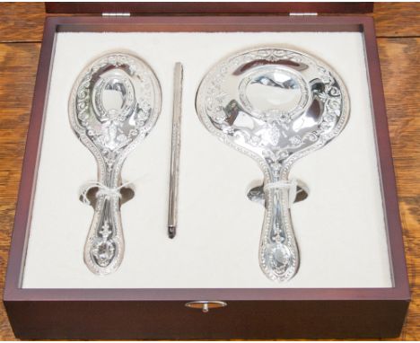 A modern Carrs jewellers three piece silver backed dressing set, comprising hand mirror, brush and comb, modern, in fitted wo