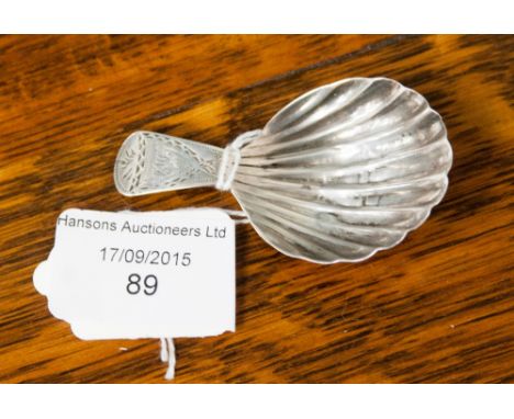 A George III silver shell caddy spoon, bright cut handle 1790.