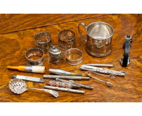 A collection of silver comprising a christening mug, a silver napkin ring, various propelling pencils, caddy spoon, plus vari