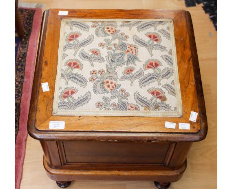 A mid 19th Century mahogany commode, raised on turned legs.