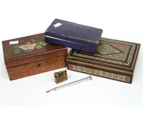A wooden box containing a quantity of silver and plated writing implements, together with an Indian box of assorted vintage f