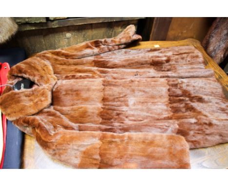 A 3/4 brown fur coat, possibly Winter ermine with shaped sleeves (George Rose of Derby) 