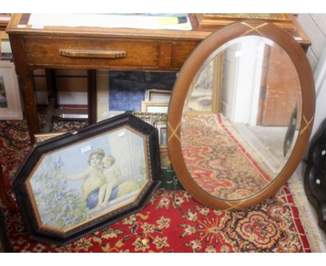 An oval wall mirror and a print (2)