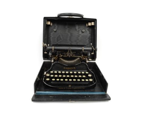 A Corona 1920's portable typewriter (Smith & Corona Typewriters Inc) black cased with cleaning brush.