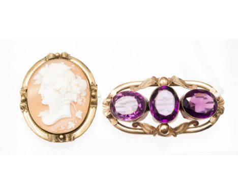 A late 19th Century Italian shell cameo brooch and a three stone amethyst brooch. (2)