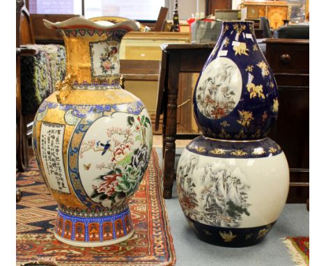 Two large modern oriental ceramic vases, both decorated with mountainous landscapes and foliate designs, height 80cm and smal