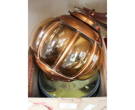 A large magnifying glass with a copper lamp.