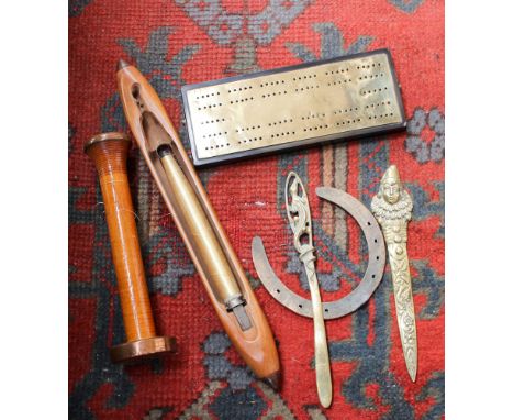 A Victorian brass and ebony cribbage board (with pegs) Shuffle & Bobbin horseshoe and two brass letter openers. (6)