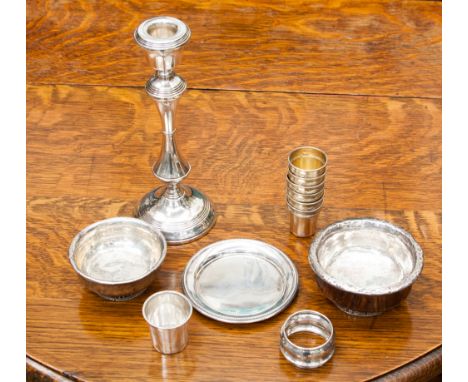 A collection of silver and white metal including two silver mazer bowls, six white metal gilt tots, a further tot, napkin rin