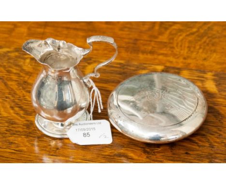 A George II style silver sparrow beak cream jug, together with a silver circular snuff box, hallmark Chester 1904 (2)
