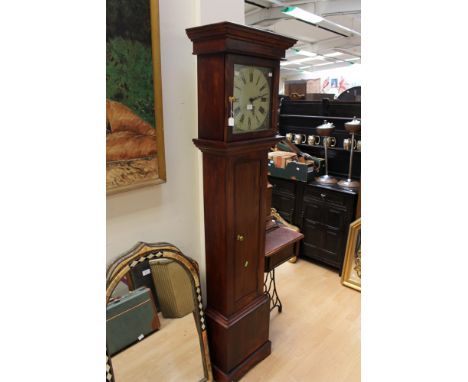 A Georgian style longcase clock with a double weighed movement, the glazed door opening to reveal a white enamel dial and bla