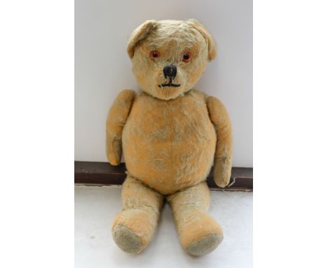 A 1940's Chiltern teddy bear, golden mohair, well loved, complete.
