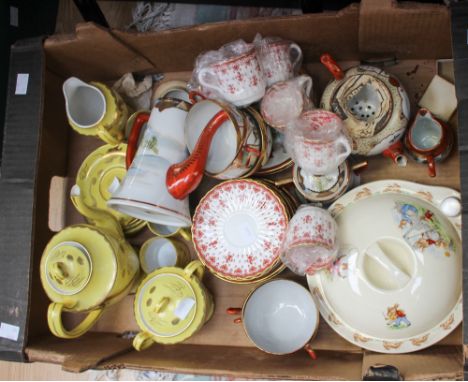  A Japanese yellow ground and gilt tea set, circa 1930, together with another Japanese tea set and a Bunnykins plate warmer a