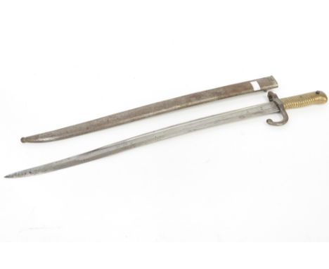 A late 19th century bayonet and scabbard, the blade inscribed and dated 1874, R.T 24637.