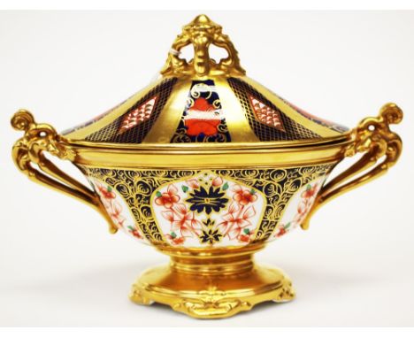 A Royal Crown Derby 1128 Imari pattern sucrier with a pierced handle to lid and two handles to body, in solid gold band, heig