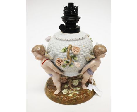 A late 20th Century continental oil lamp base with cherubs.