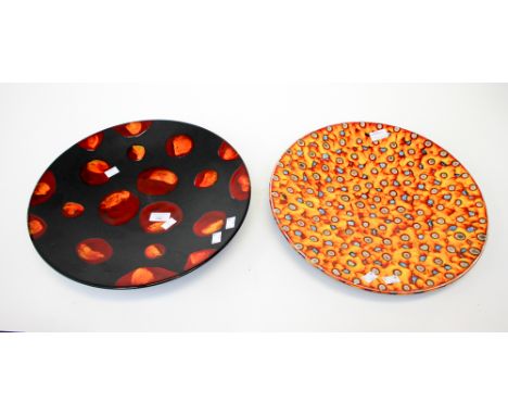 A Poole pottery charger, 'Galaxy' pattern, together with an Anita Harris studio charger. (2)
