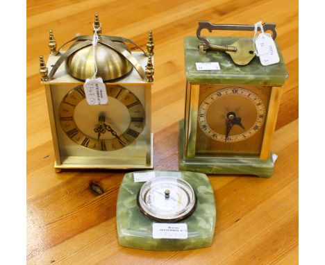 An onyx and gilt carriage clock, an onyx barometer and a brass cased mantle clock.
