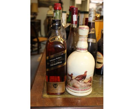 Famous Grouse Whisky in ceramic decanter and Johnny Walker Black Label 12 year old.