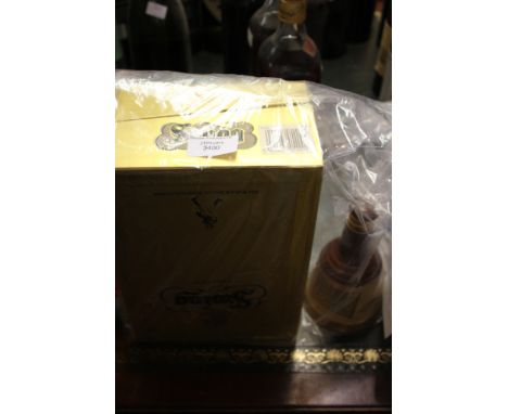 A Johnnie Walker 'SWING' Scotch Whisky bought mid 1980s, in original box 75cl 40% and a 1980s Bells Scotch Whisky 70% proof
