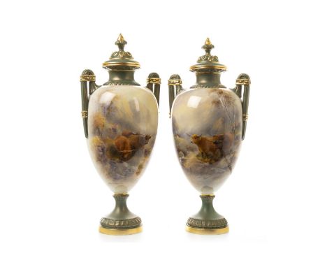 ROYAL WORCESTER PAIR OF VASES AND COVERS, painted with Highland cattle in landscape with cottages and streams, by John Stinto