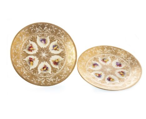 PAIR OF ROYAL WORCESTER CIRCULAR PLATES, retailed by Tiffany &amp; Co of New York, painted with reserves of fruit within gilt