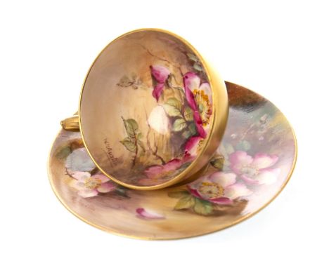 ROYAL WORCESTER CUP AND SAUCER, painted with flowers, by W H Austin, signed, printed marks in puce, the saucer 10cm diameter