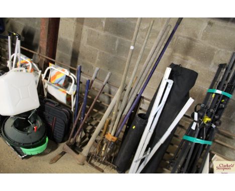 A quantity of long handled garden tools