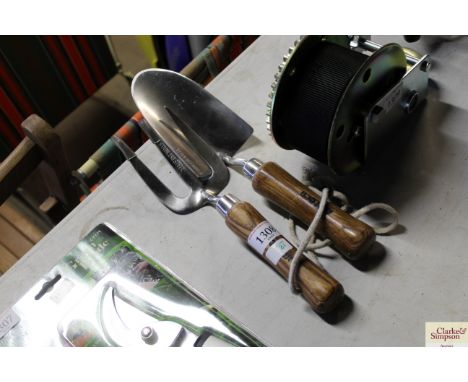A pair of stainless steel garden trowel and fork set