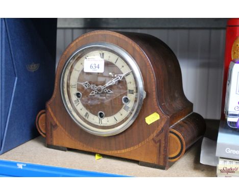 An Art Deco walnut cased three hole mantel clock