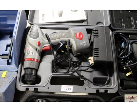 A Performance Power cordless hammer drill with charger in case
